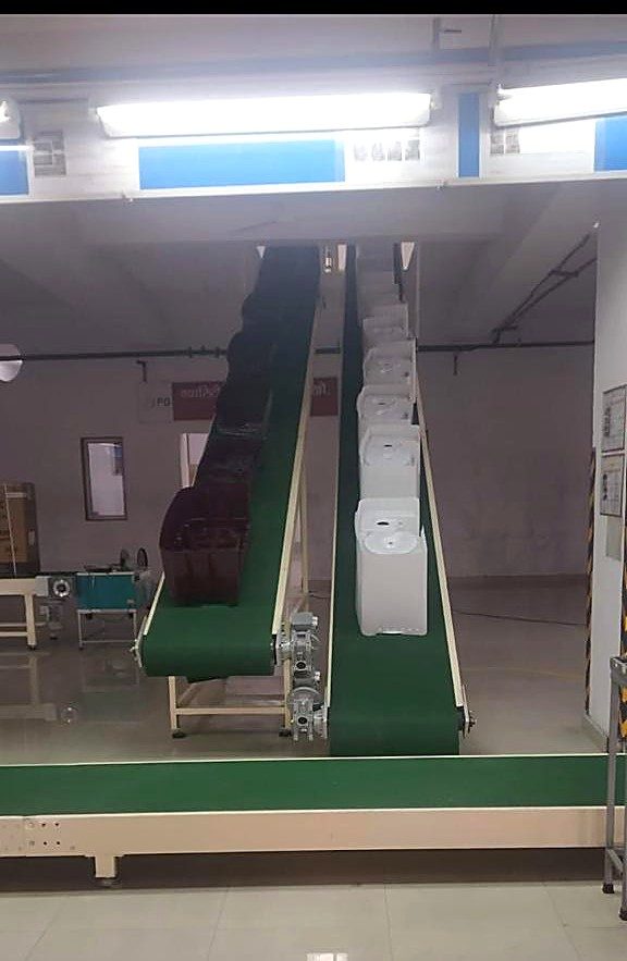 Incline belt conveyor built and installed by Wellman Elevator, Noida